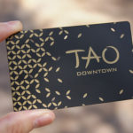 metal business card with black finish and gold