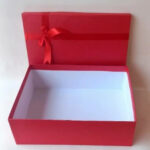 Red Gift Box With a Lid And a Decorative Ribbon