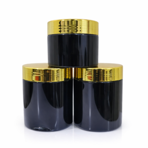 Cream jars with shiny gold lids for skincare, cosmetic, body cream, and beauty product packaging.