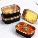 Black paper plate with transparent lid for takeaway meals and food packaging supplied by Eloquent Prints and Packaging in Lagos, Nigeria.